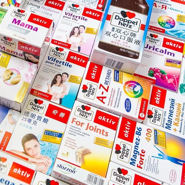 Various boxes of dietary supplements from the brand Doppelherz are displayed, featuring a range of products aimed at different health benefits. Labels include "Mama," "For Joints," "A-Z RETARD," and "Vi Fertile," indicating the intended use for multiple audiences and health needs.